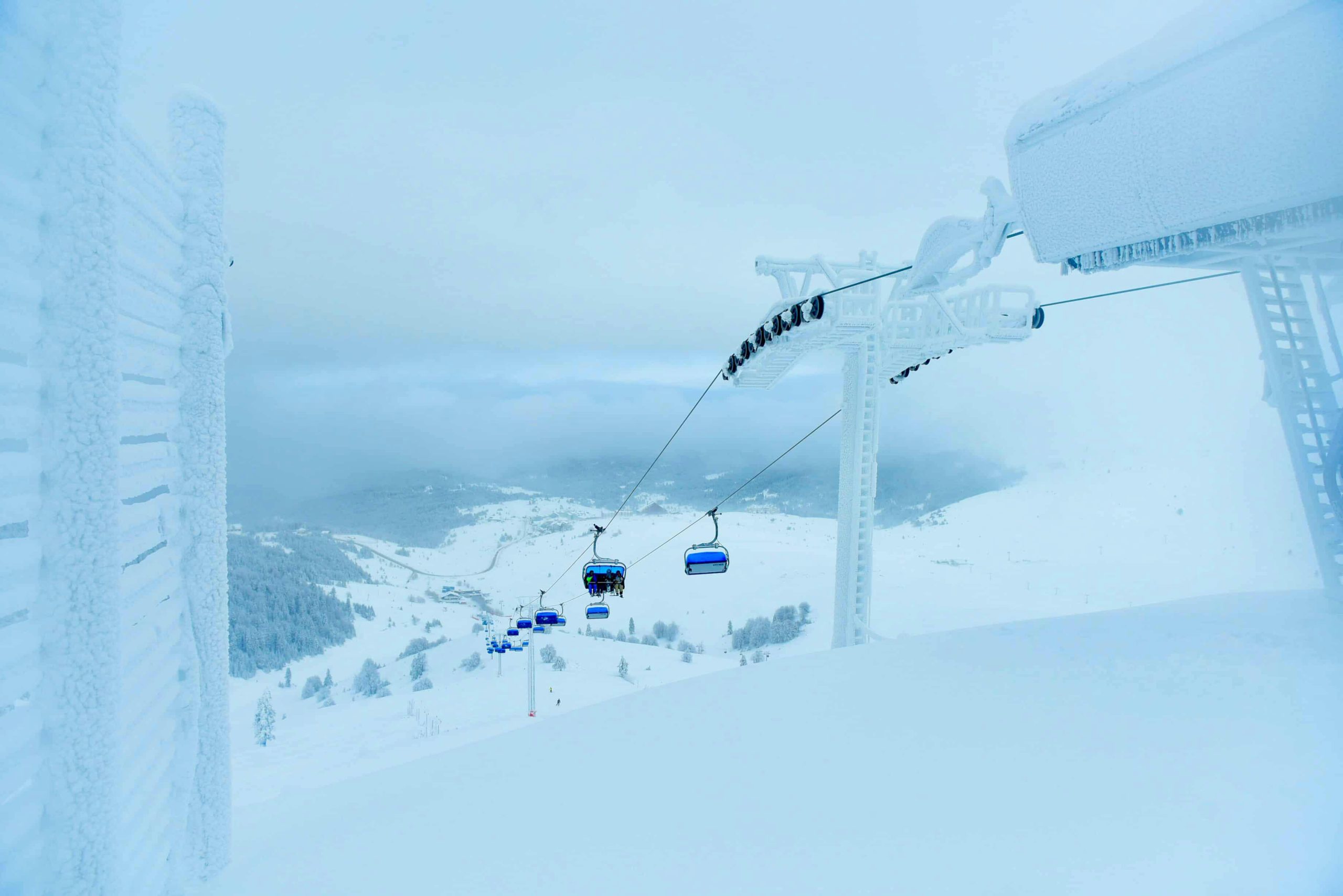 Snow-covered ski lift on a winter day in Uludağ Mountain, Bursa, Turkey.